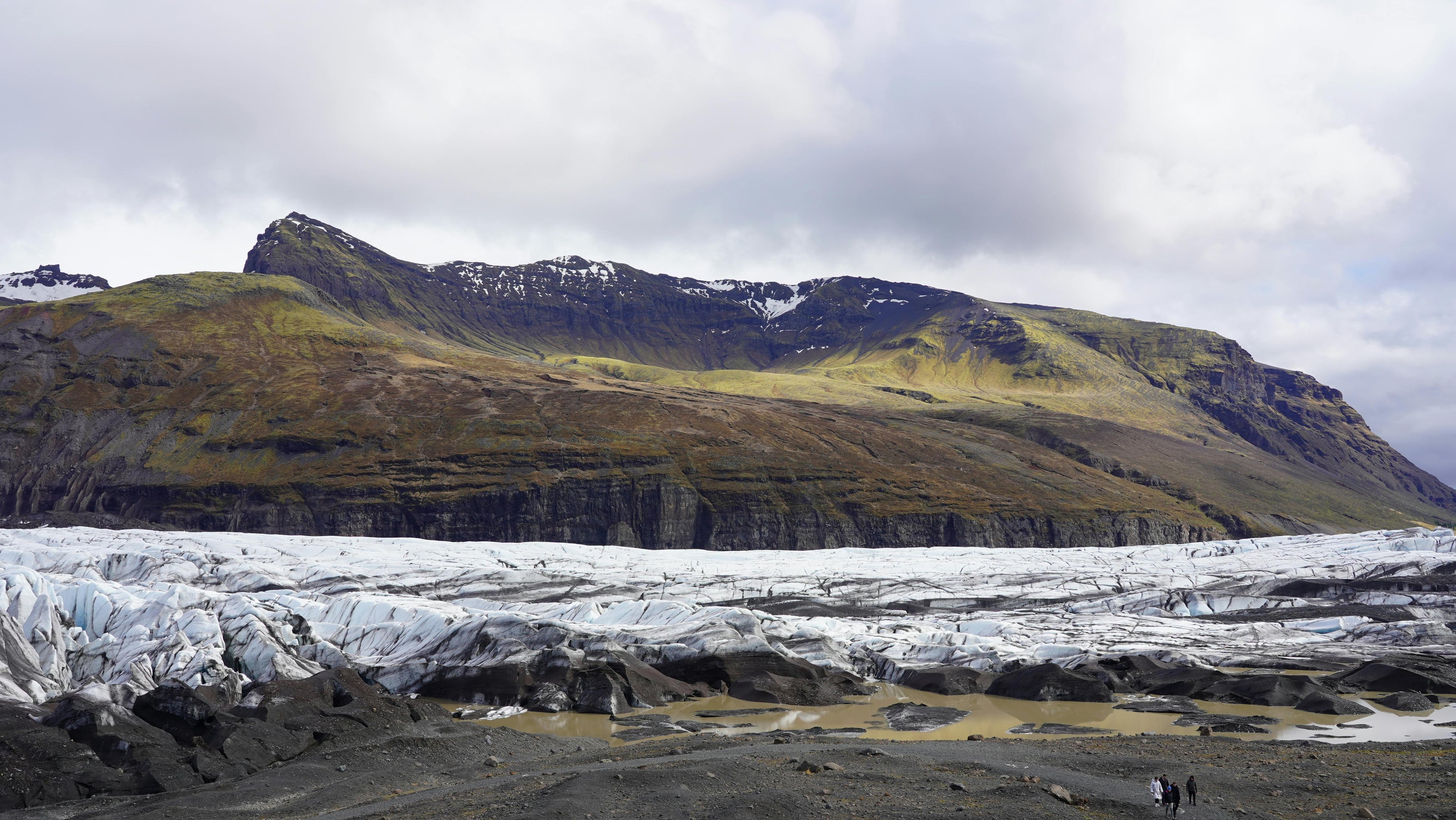 Glacier landscape with mountains and cloudy sky