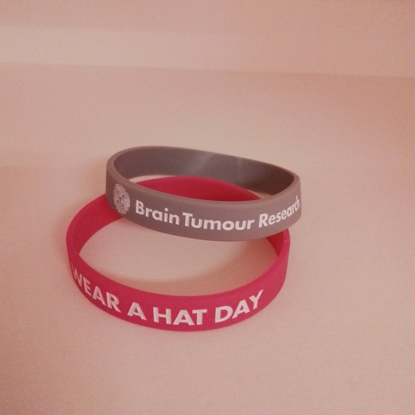 Wear A Hat Day Wristband - mixed box of 24 - 12 pink & 12 grey